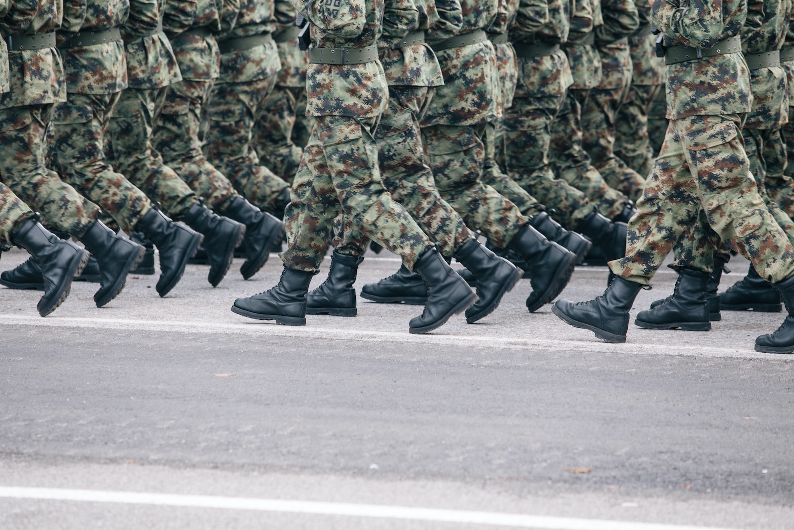 men in green and brown camouflage uniform