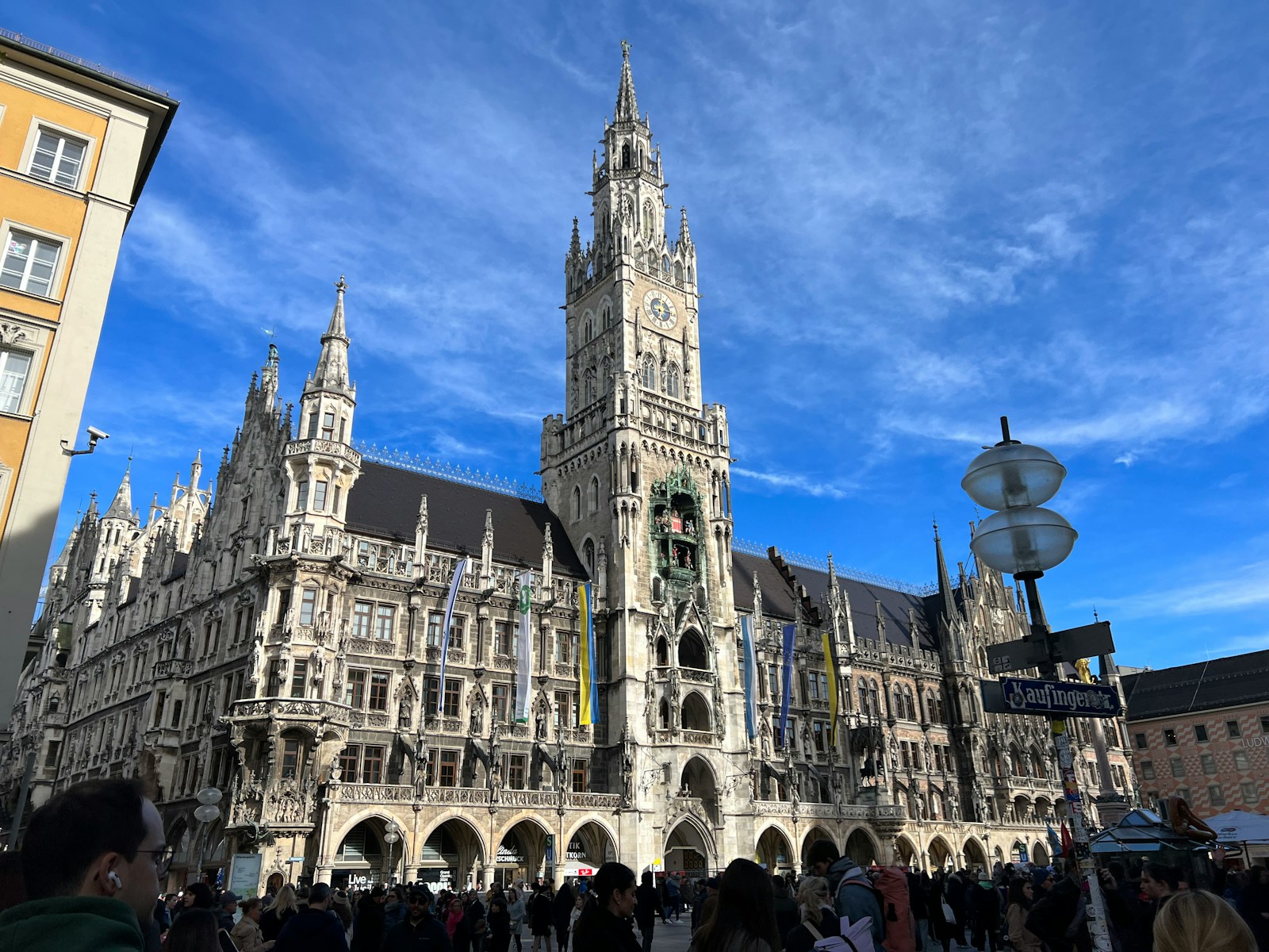 a group of people standing in front of a large building